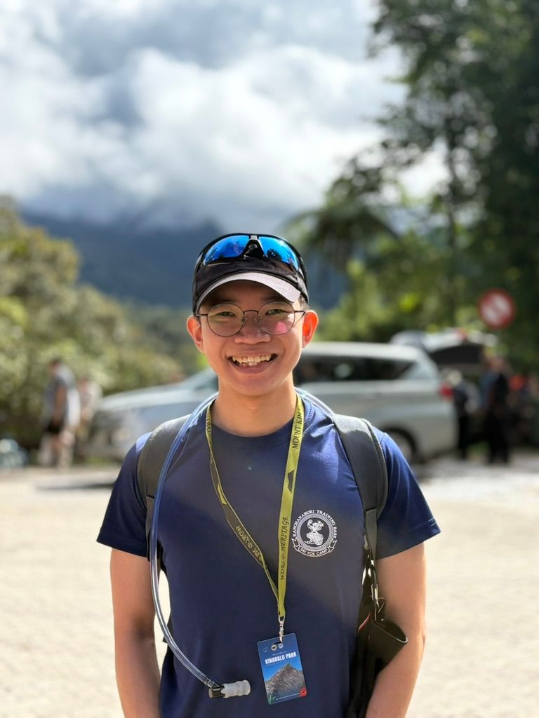 Bryan smiling at the foot of Mount Kinabalu